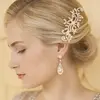 1. 'Halo' Gold Cubic Zirconia Mosaic Teardrop Bridal Earrings thumbnail